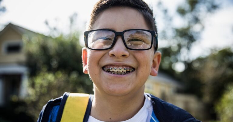 school age boy laughing