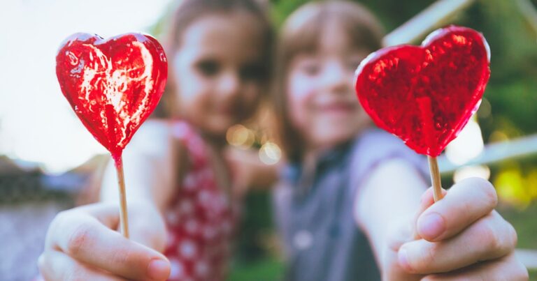 two children with lollipops