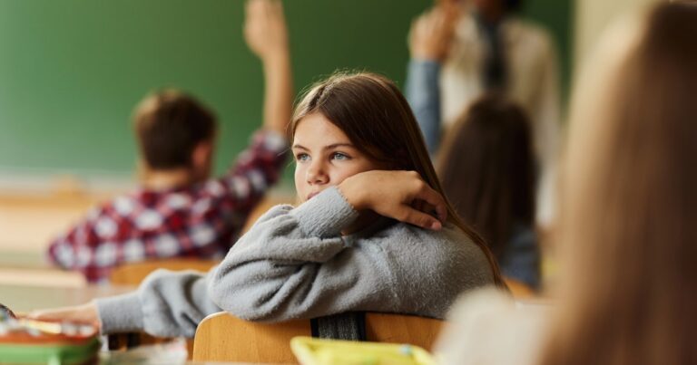 sad schoolgirl attending a