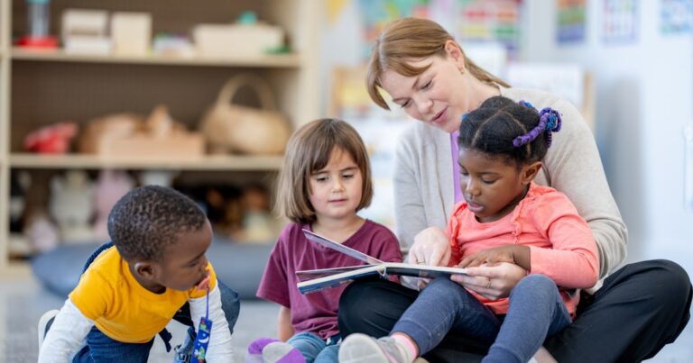 a daycare teacher sits