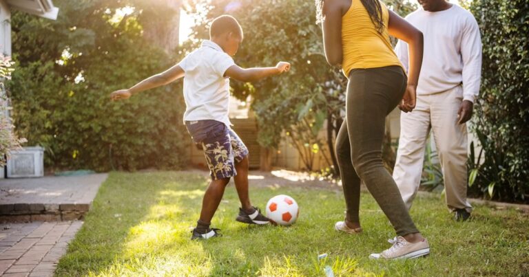 small boy playing soccer